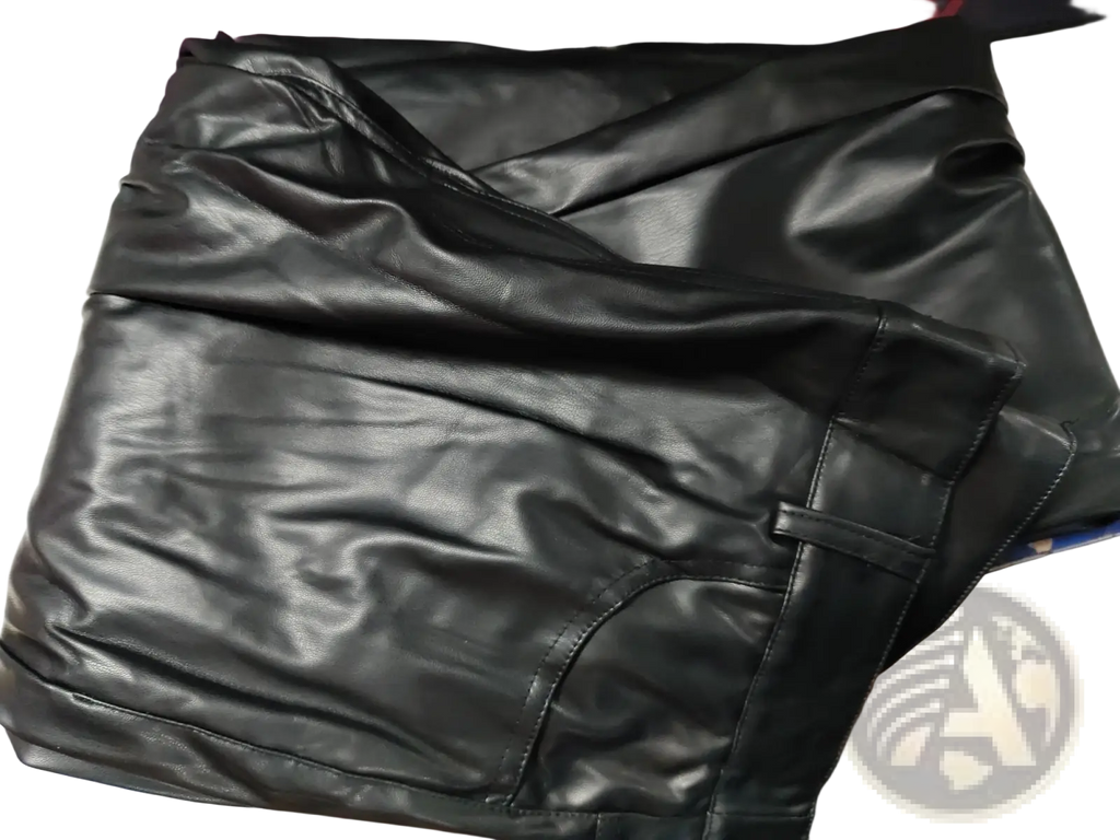 Men black faux leather pants with a smooth glossy finish and visible stitching along the seams in slim fit style