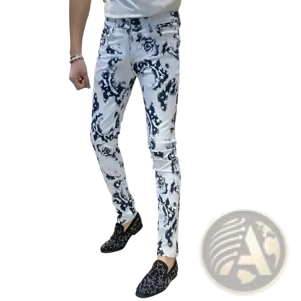 Men black floral slim fit jeans in white denim with bold black floral pattern paired with embellished loafers