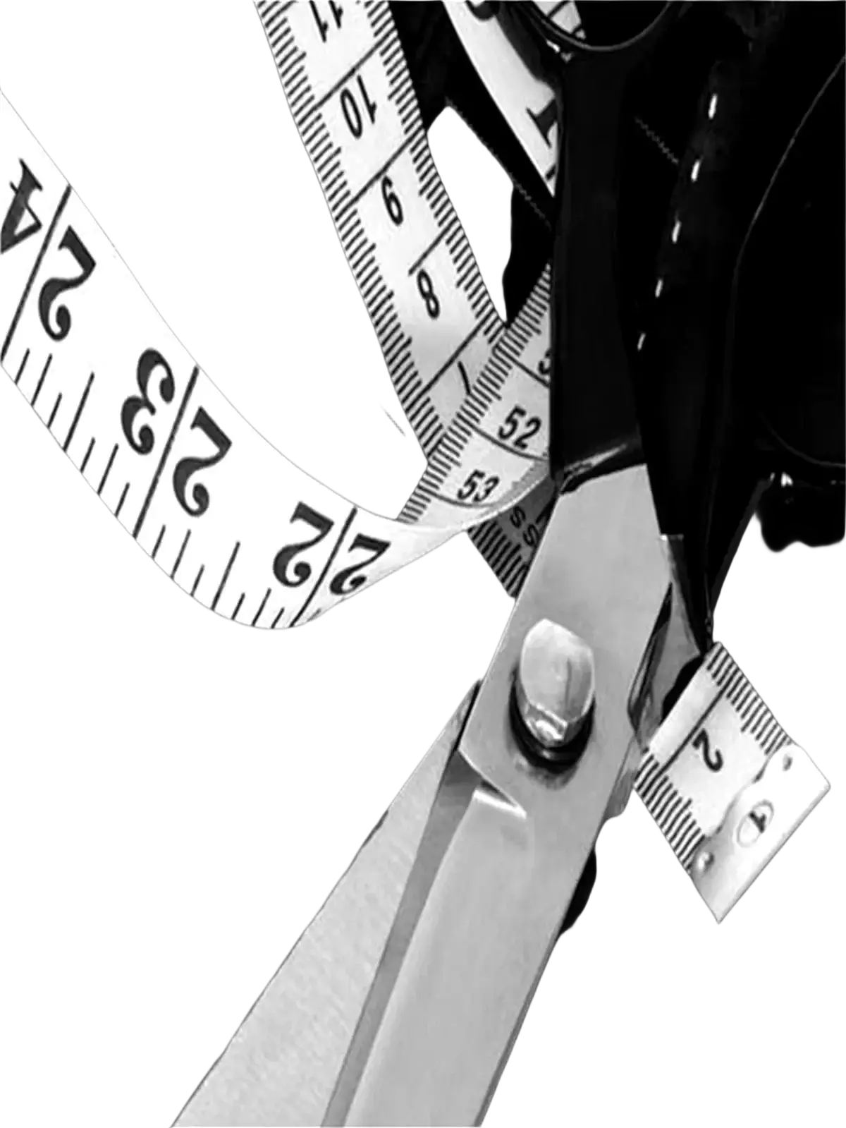 A pair of sharp metallic scissors beside a coiled measuring tape on dark fabric for men black gold stripe suit pants