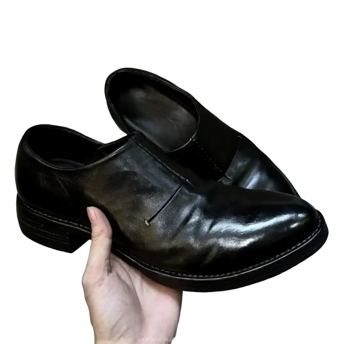 Men black leather vintage slip on dress shoes with polished finish and visible stitching