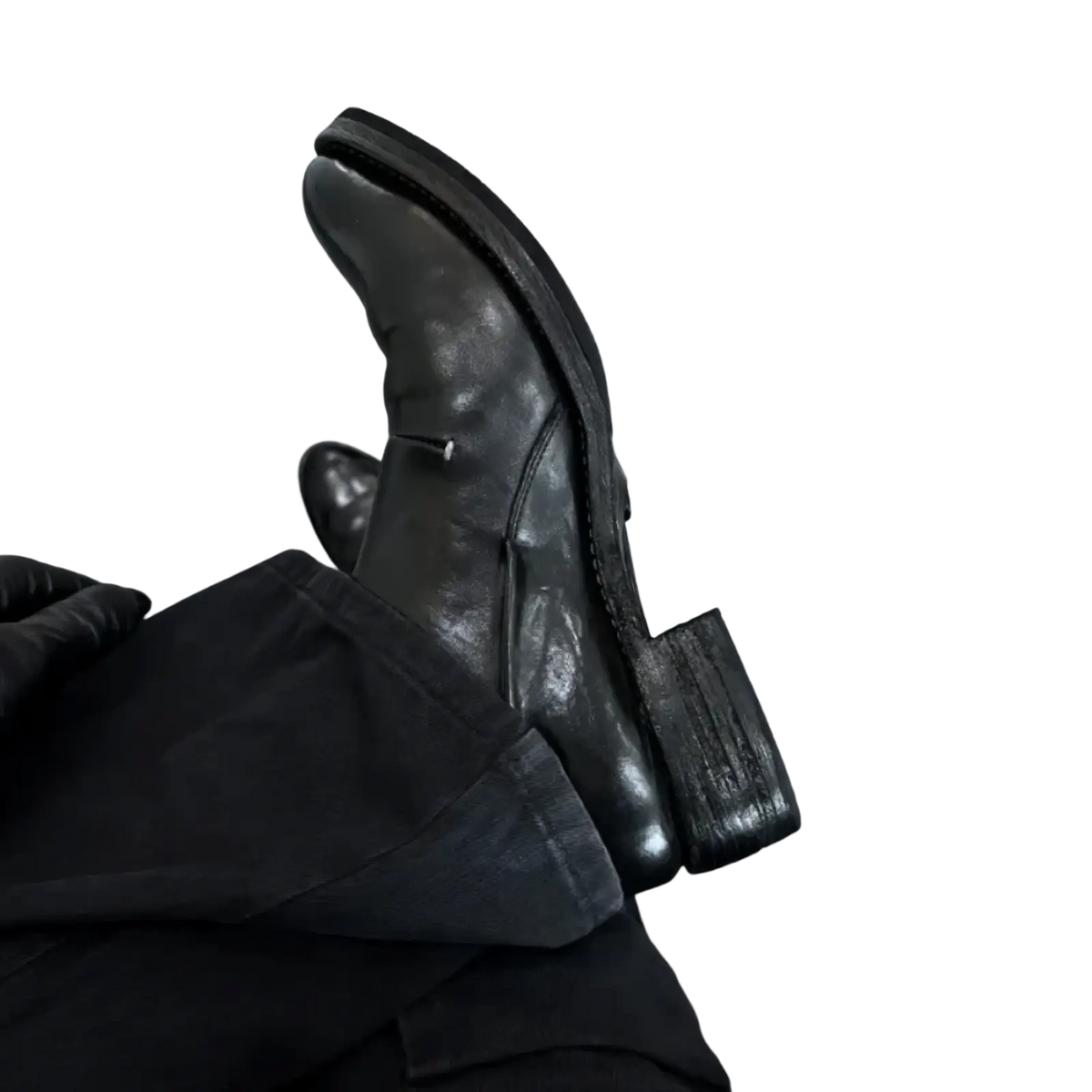 Men black leather vintage slip on dress shoe featuring a chunky heel and visible stitching details