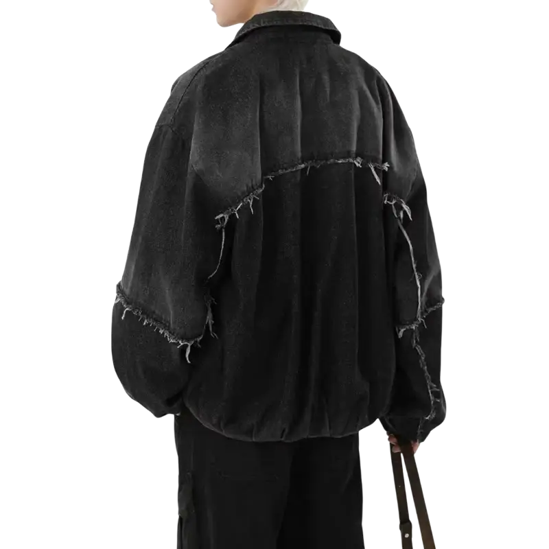 Men black niche bomber jacket in distressed denim with frayed edges and relaxed oversized fit showcasing design sense niche