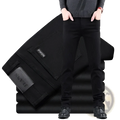 Men black slim fit stretch denim jeans with visible stitching details showcasing a sleek denim texture