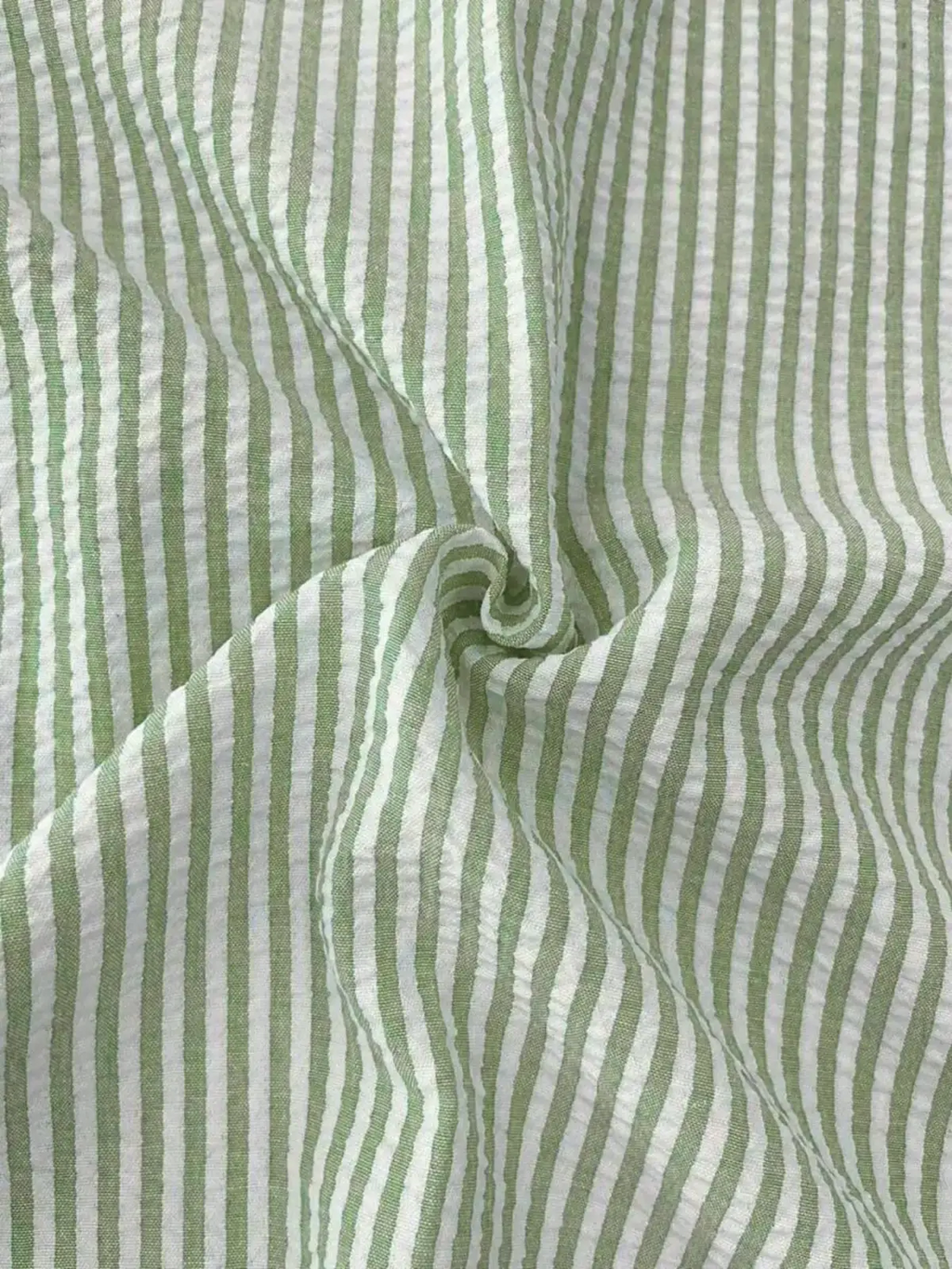Men blue striped long sleeve casual button down shirt made of light green and white striped cotton with crinkled texture