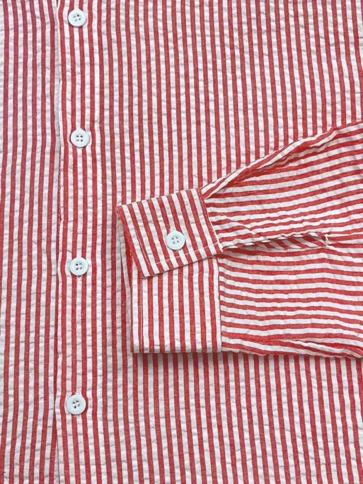 Men blue striped long sleeve casual button down shirt with red and white vertical stripes and lightweight textured fabric
