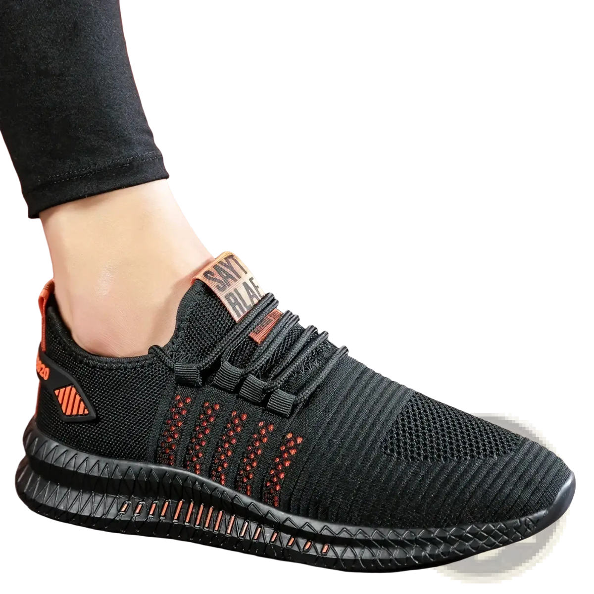 Men breathable casual knit sneakers featuring black knit material with orange accents and a textured sole