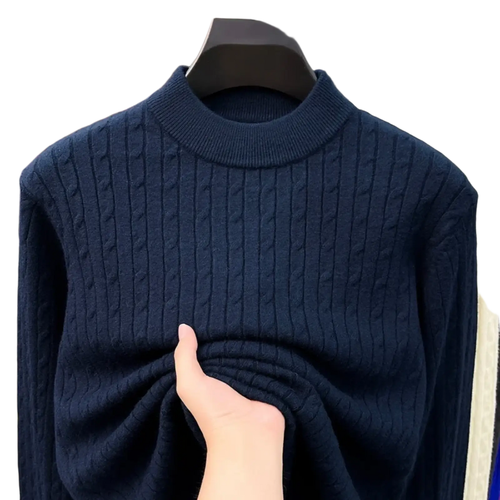 A navy blue men cable knit sweater crewneck pullover with ribbed collar and textured vertical patterns
