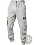Gray heathered men cargo pants with black drawstrings and zippered cargo pockets for casual wear