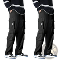 Men cargo pants in black featuring multiple pockets and a white a logo on the thigh pocket for workwear use