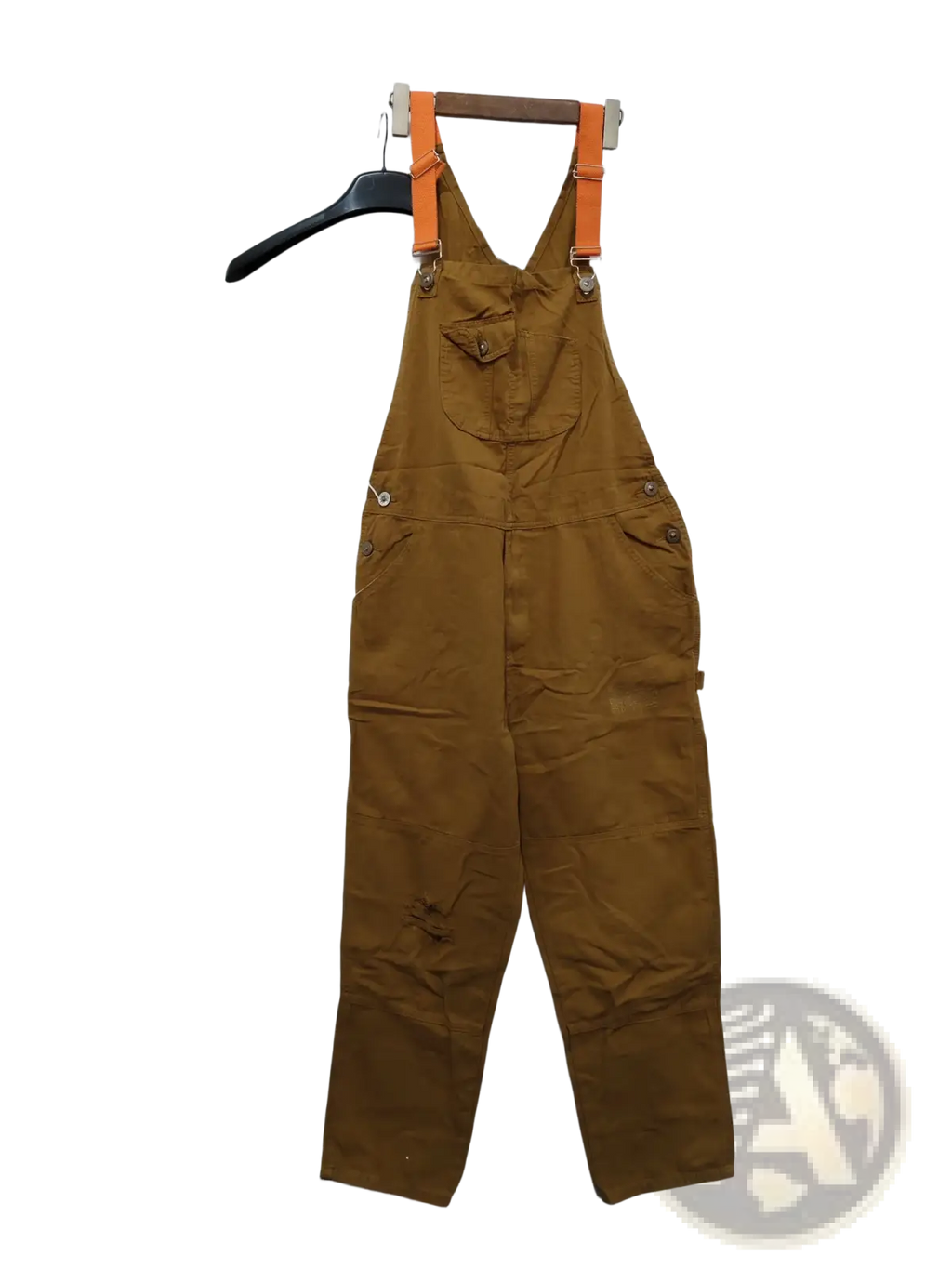 Men cargo suspender jumpsuit made of brown canvas with orange suspenders hanging on a wooden hanger