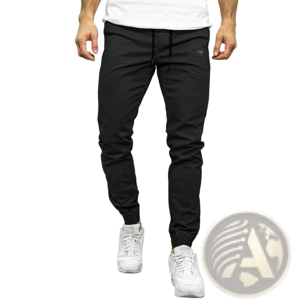 Men casual jogger pants in black with a drawstring waist made from soft stretchy quick dry fabric and tapered legs