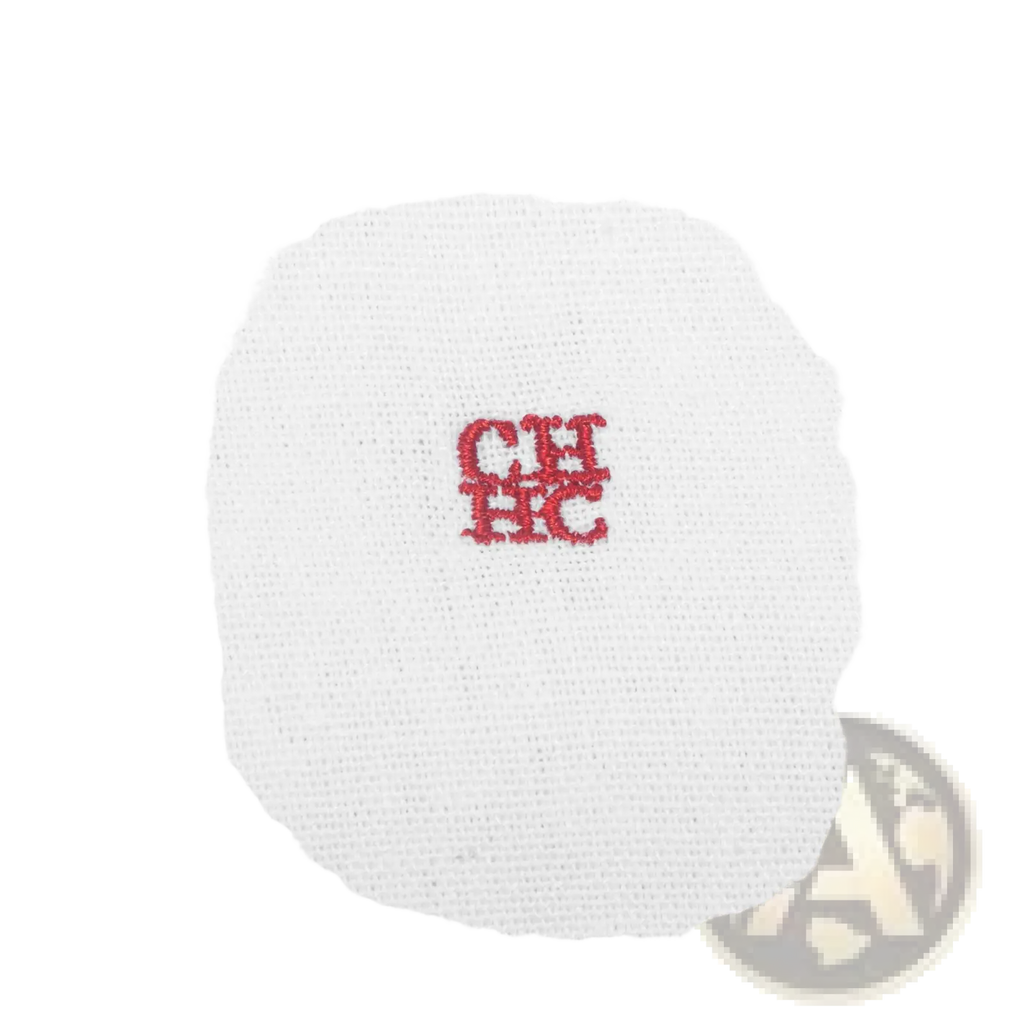 White cotton t-shirt with a small red embroidered logo paired with a men casual linen long sleeve button down shirt