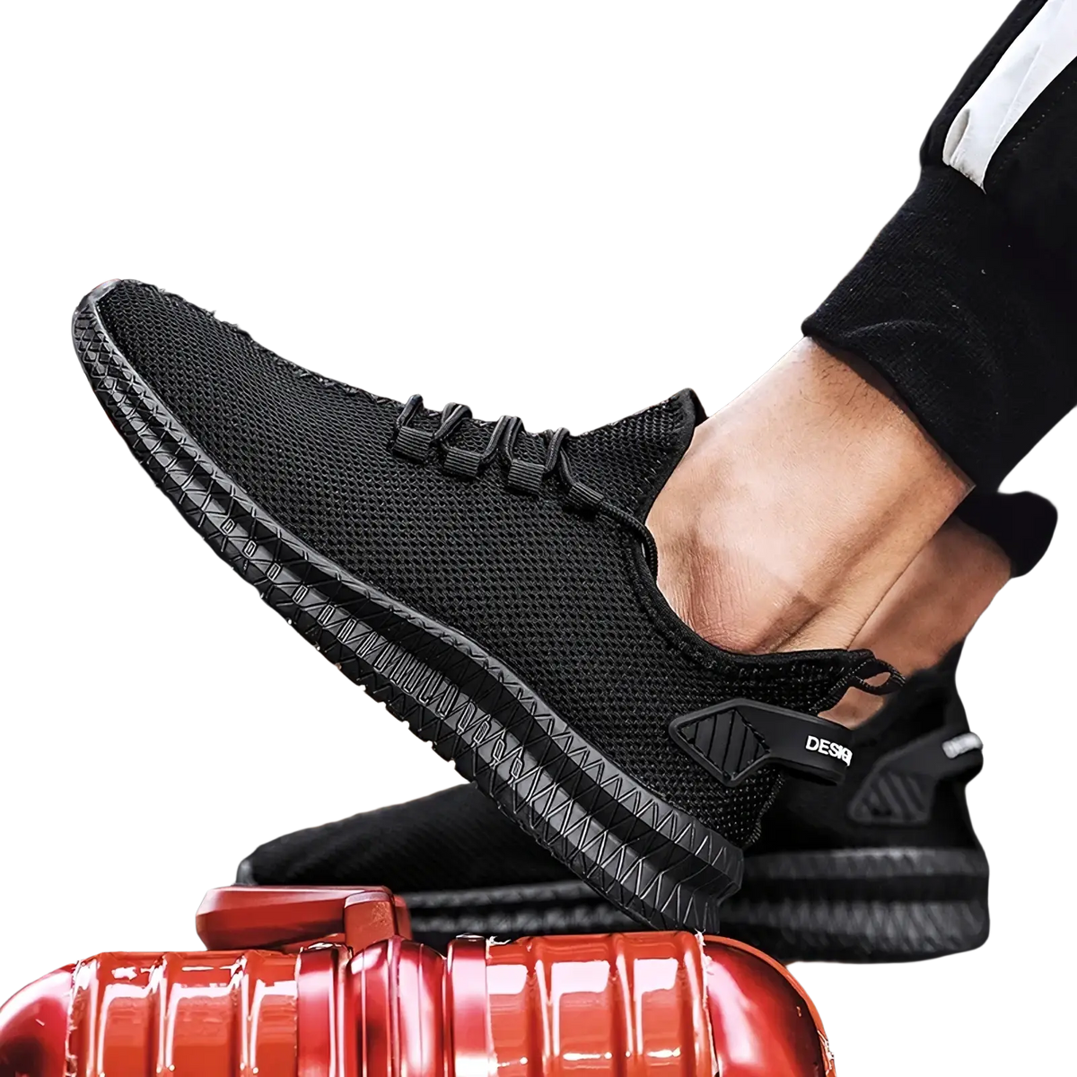 Black mesh men casual sneakers showing back side with textured rubber sole and subtle brand logo on heel