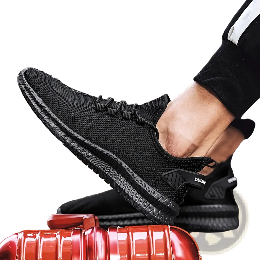 Black mesh men casual sneakers showing back side with textured rubber sole and subtle brand logo on heel