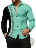 A men classic business casual long sleeve shirt in vibrant teal and black color block with gray reflective stripes and kong logo