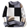 Men color blocked geometric knit sweater in chunky knit with bold black white gray and beige patterns and cable textures