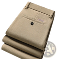 Beige men corduroy business casual pants with subtle ribbed texture and small brand label on front pocket