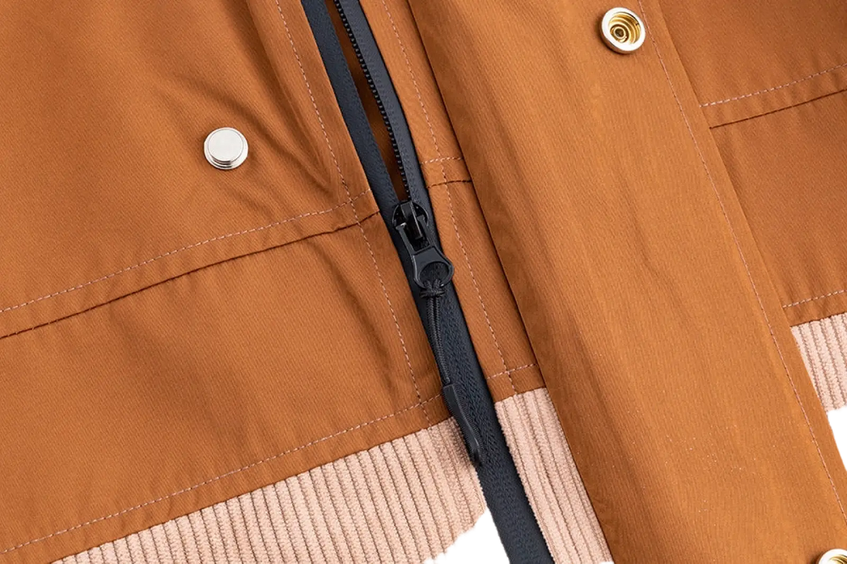 Men corduroy canvas hooded jacket in tan with black zipper and metallic buttons for casual wear