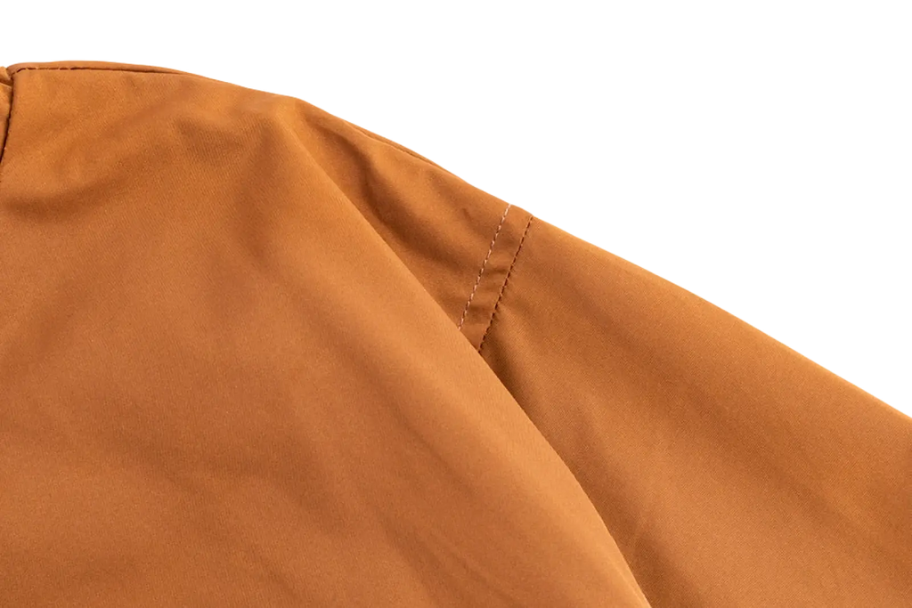 Tan-colored men corduroy canvas hooded jacket with neatly stitched seams and durable fabric for casual wear