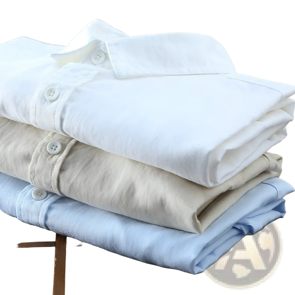 Stack of three neatly folded men cotton linen casual long sleeve shirts in white beige and light blue with buttons