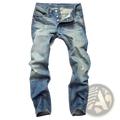 Men distressed slim fit denim pencil pants in blue washed denim with faded wash and subtle orange stitching accents