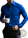 A man wearing a vibrant royal blue long sleeve smart casual dress shirt with a crisp collar and button-down front