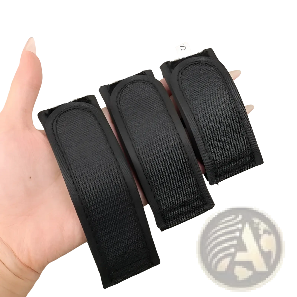 Three black elastic no buckle belt strap holders in fabric marked with size labels s m and l for adjustable waist band