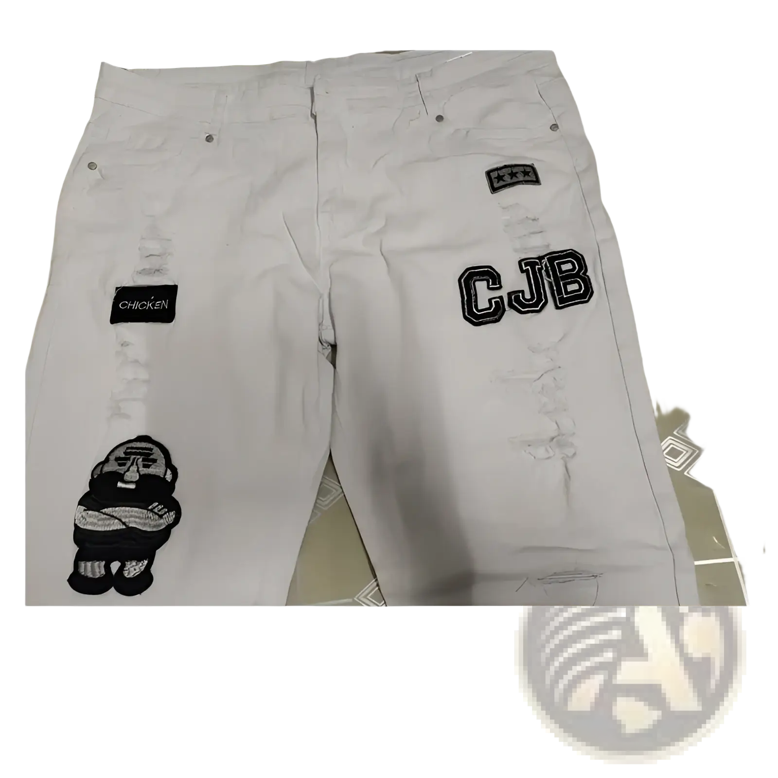 Men embroidered ripped skinny jeans in white denim featuring black cjb patches and a cartoon chicken design