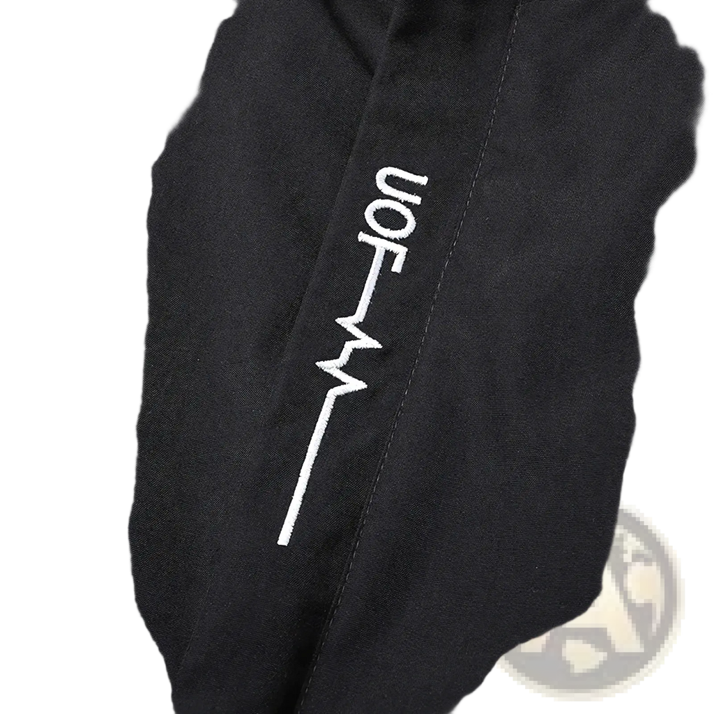 Men embroidered windbreaker jacket in black with white stylized heartbeat-like jon logo embroidery on front