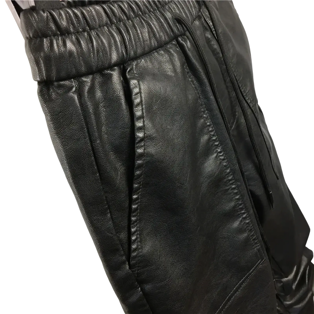 Men faux leather cargo joggers in black featuring an elastic waistband and side pockets for casual wear