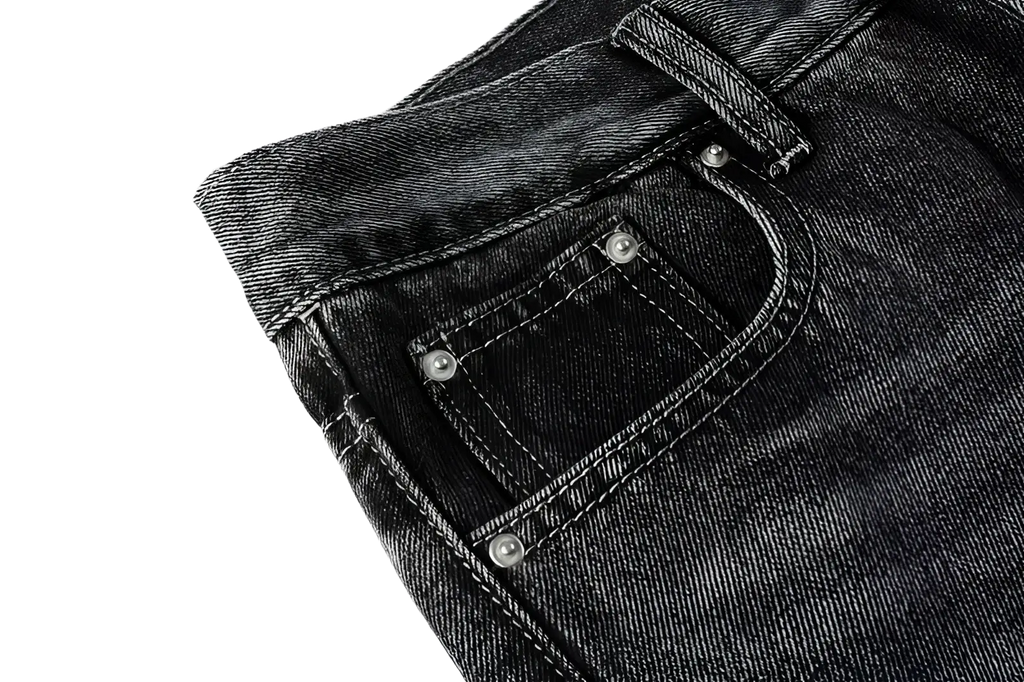 Men flare jeans in distressed dark gray denim with dark-wash fabric, classic front pockets, and silver-toned rivets
