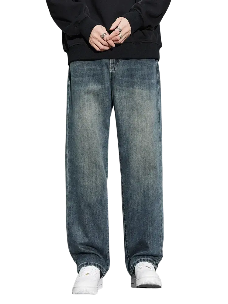 Men fleece lined baggy straight jeans in blue denim with a relaxed wide leg cut and faded wash