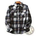 Men fleece lined plaid shirt jacket in navy white and tan with buttoned chest pockets and cozy flannel material