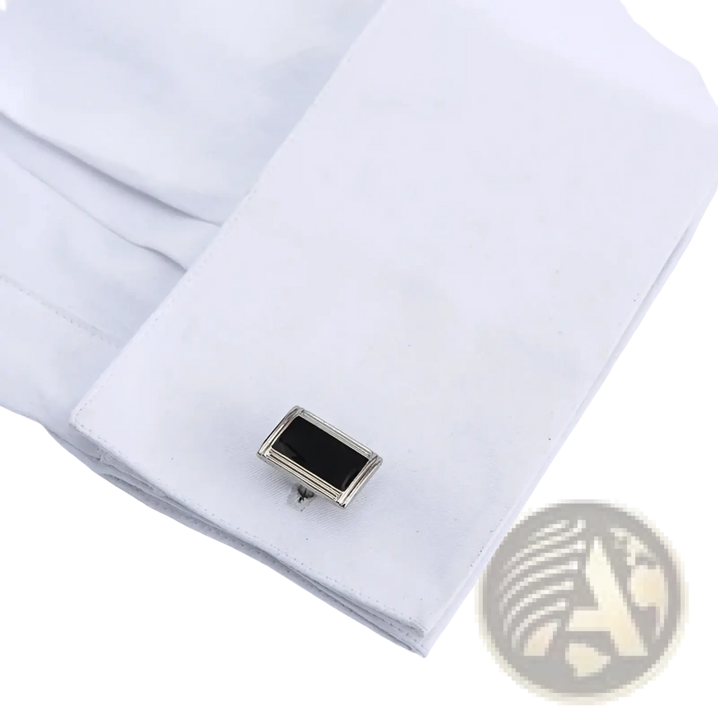 Silver rectangular cufflink with black onyx center on white men french cuff dress shirt for business formal wear
