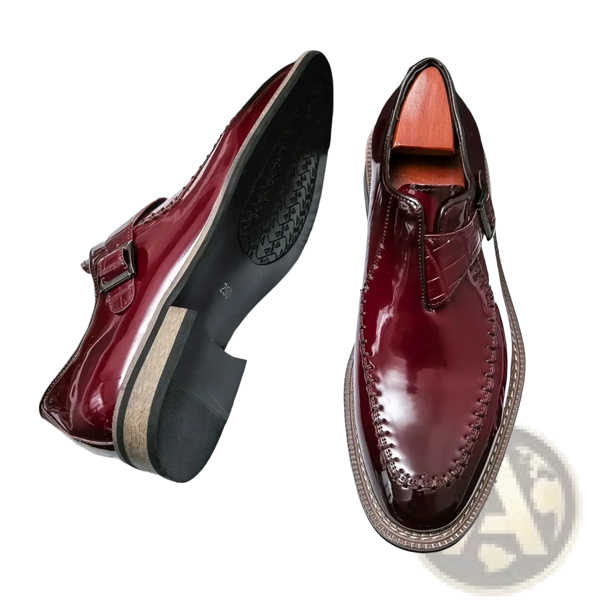 Men glossy patent leather dress shoes in polished burgundy slip-on style with sleek finish and decorative toe stitching