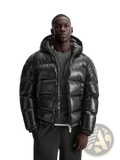 Black glossy quilted puffer jacket for men with hood designed as a winter coat