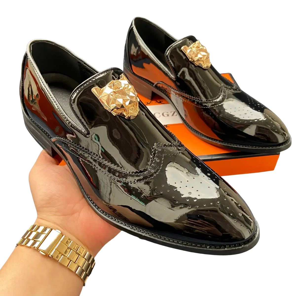 Men gold lion brogue loafers in black patent leather with gold-tone lion head wingtip embellishments