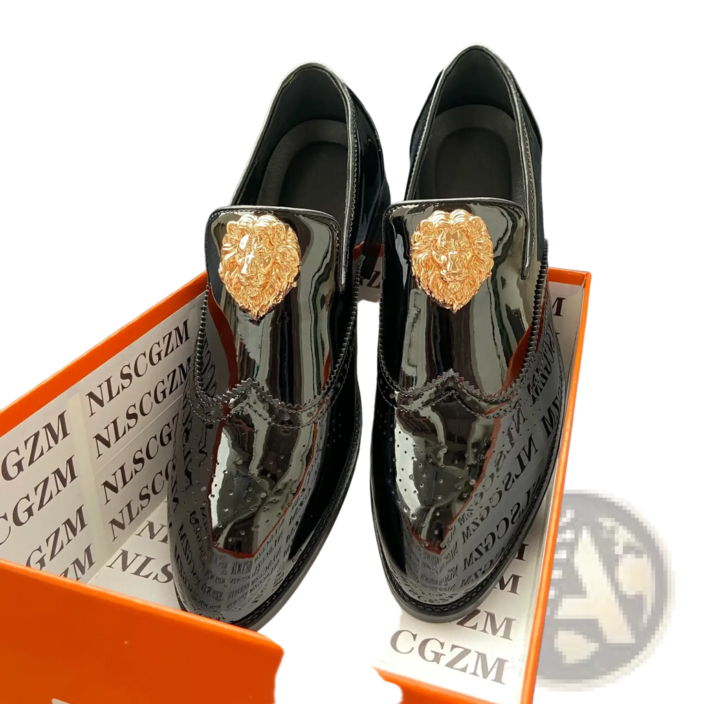 Black patent leather men gold lion brogue loafers with gold lion head embellishments and detailed brogue design