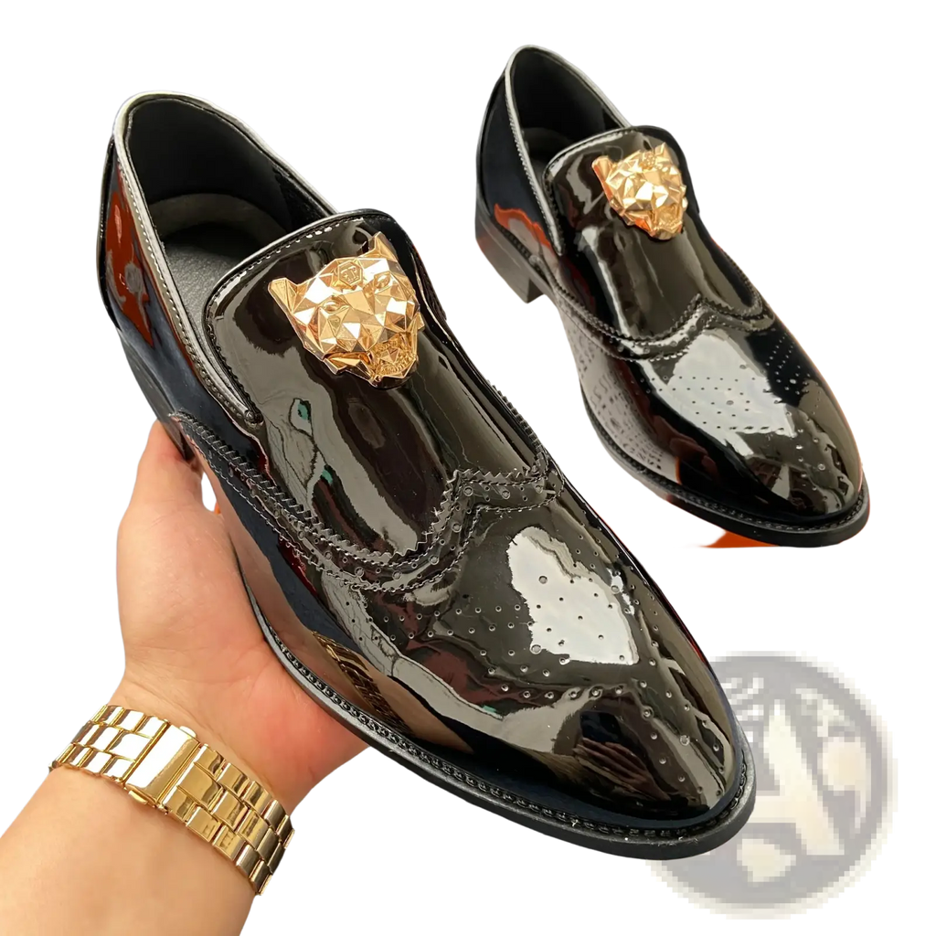 Black patent leather men gold lion brogue loafers with gold-tone lion head embellishments and brogue detailing