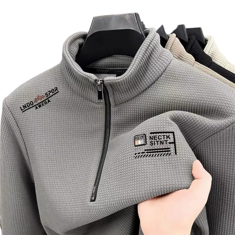 Men half zip fleece hoodie offers gray textured material with black zipper and embroidered chest logos for casual outerwear