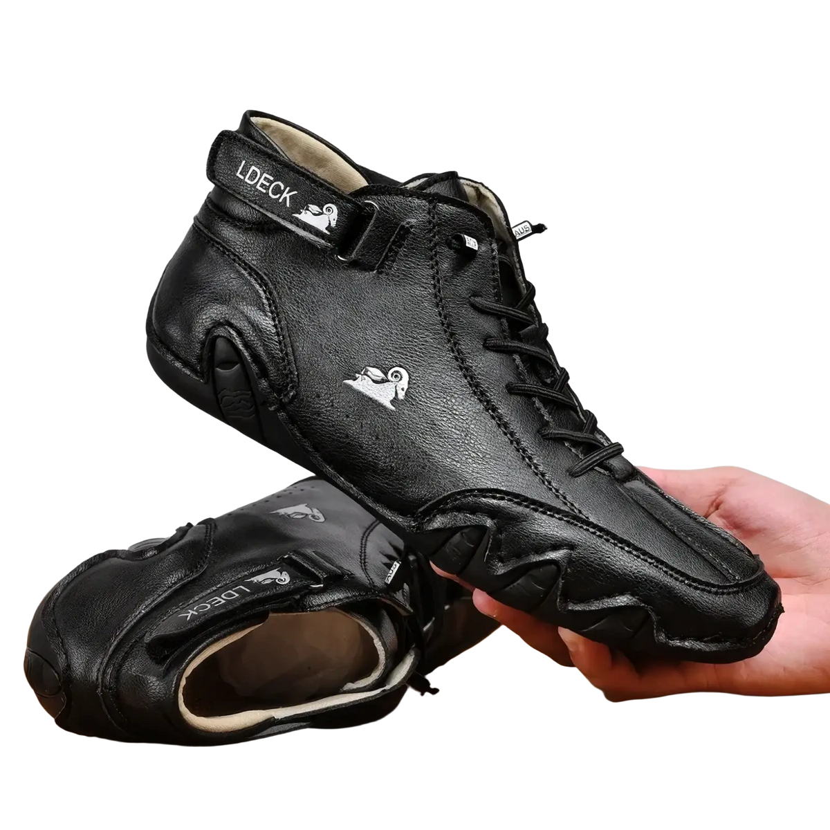 Men high top leather casual sneakers in black featuring a white ram logo and ldeck branding on the side