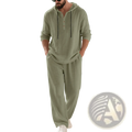 A man wearing a sage green cotton blend men hooded loungewear set with black drawstrings and matching pants