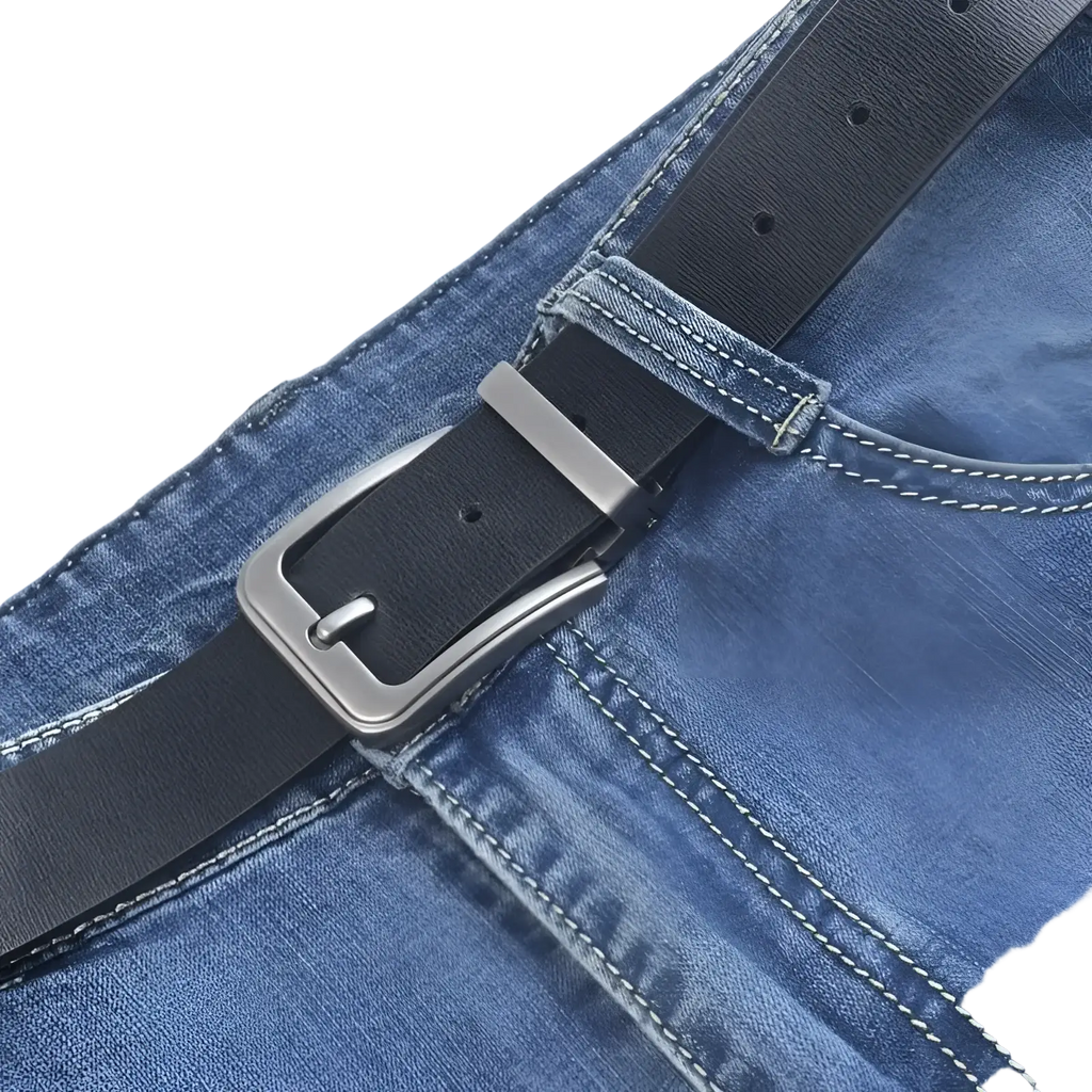 Men leather belt classic pin buckle black leather with silver-toned buckle fastened around blue denim jeans