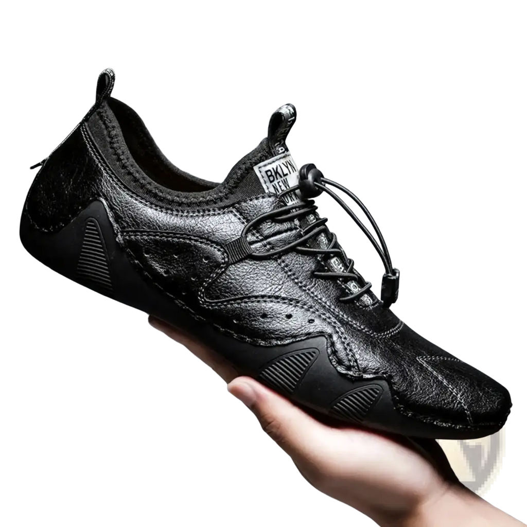 Black leather casual sneaker with textured upper rubber sole and pull-tab lace system for men luxury fashion loafers