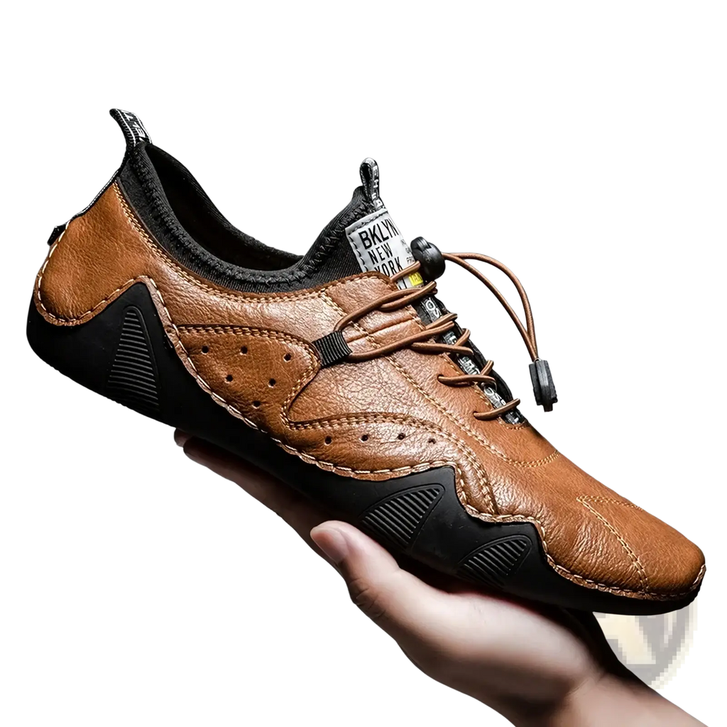 Men leather casual sneaker in brown with black accents and perforated detailing for luxury fashion loafers