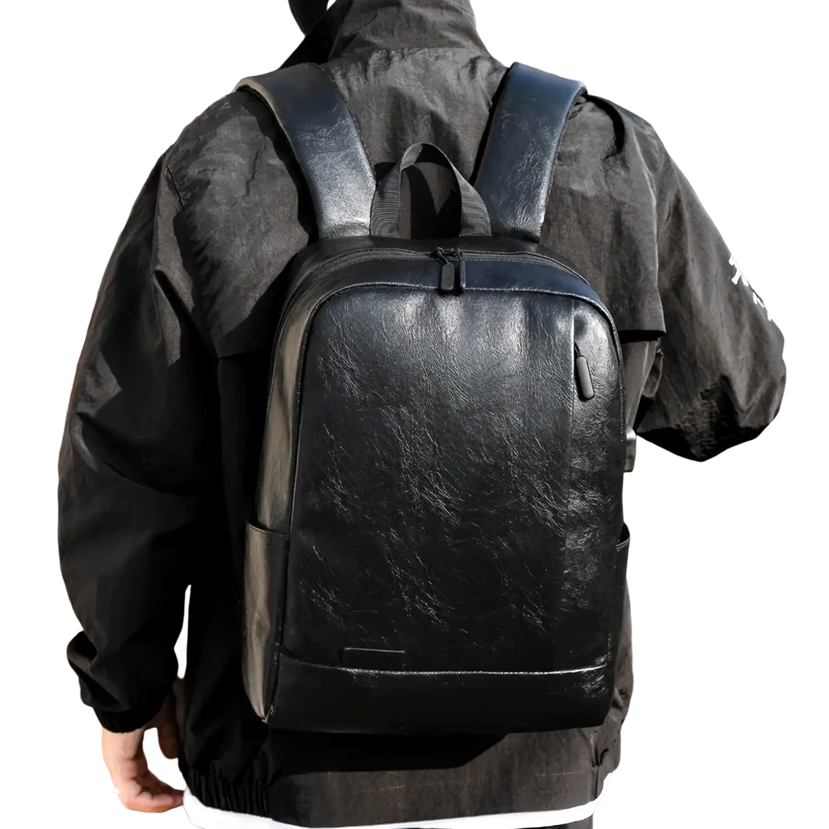 Black leather laptop backpack with subtle texture and sleek design for men business travel use