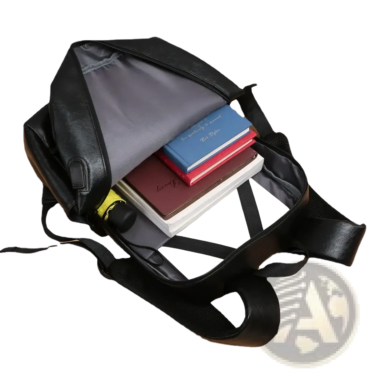 Men leather laptop backpack business travel bag in black leather with gray interior and black straps filled with books