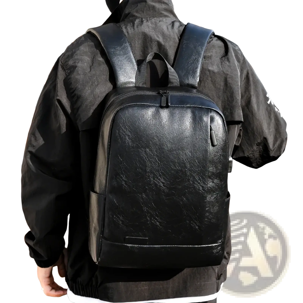 Black leather laptop backpack with subtle texture and sleek design for men business travel use