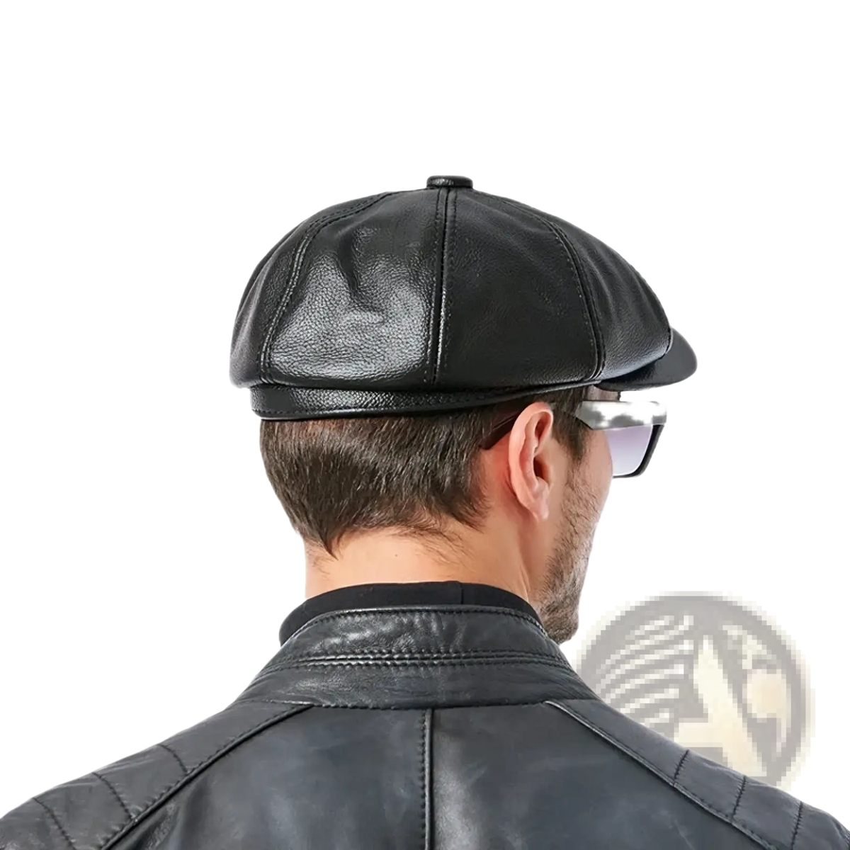 Black leather octagonal flat cap with structured six-panel design and stitched seams made of genuine cowhide