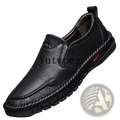 Black leather men slip on dress shoe with stitched detailing and textured sole for formal wear